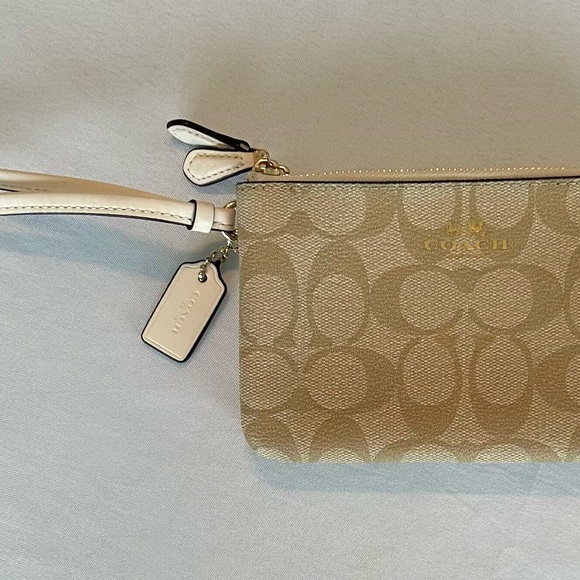 Coach Signature Double Zipper Wristlet in Tan and White with gold trim. - Picture 3 of 5